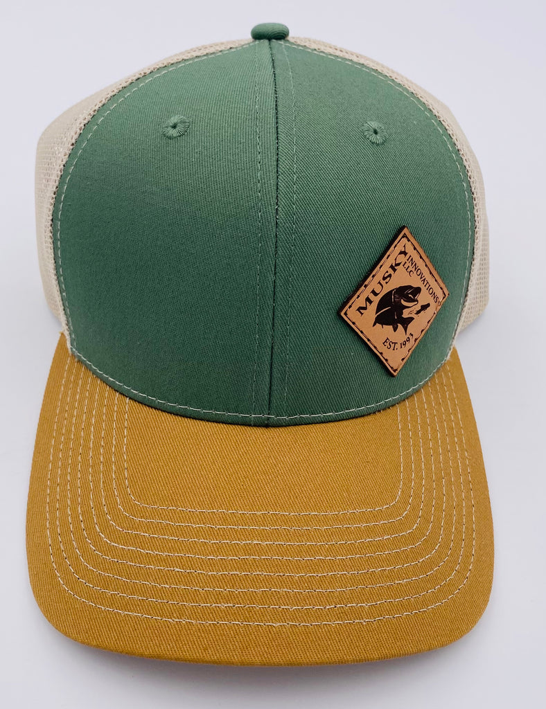 Green, Cream, and Mustard trucker hat with off set leather patch logo