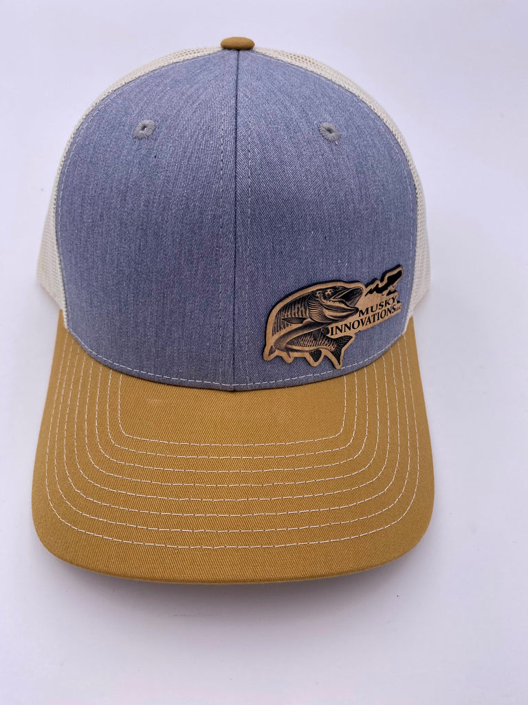 Grey and cream trucker hat with off set leather patch logo